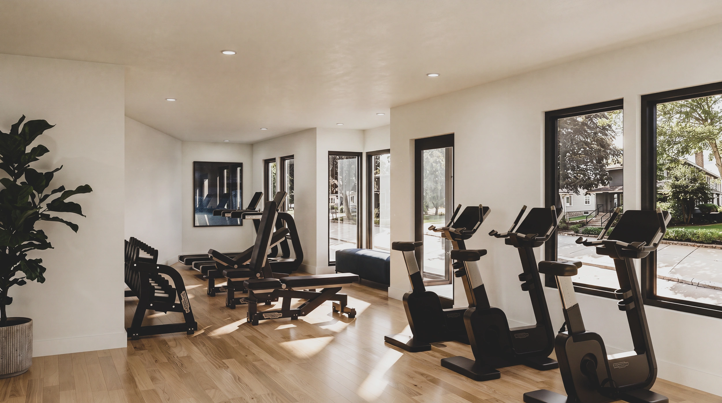 Fitness room with exercise equipment and natural light