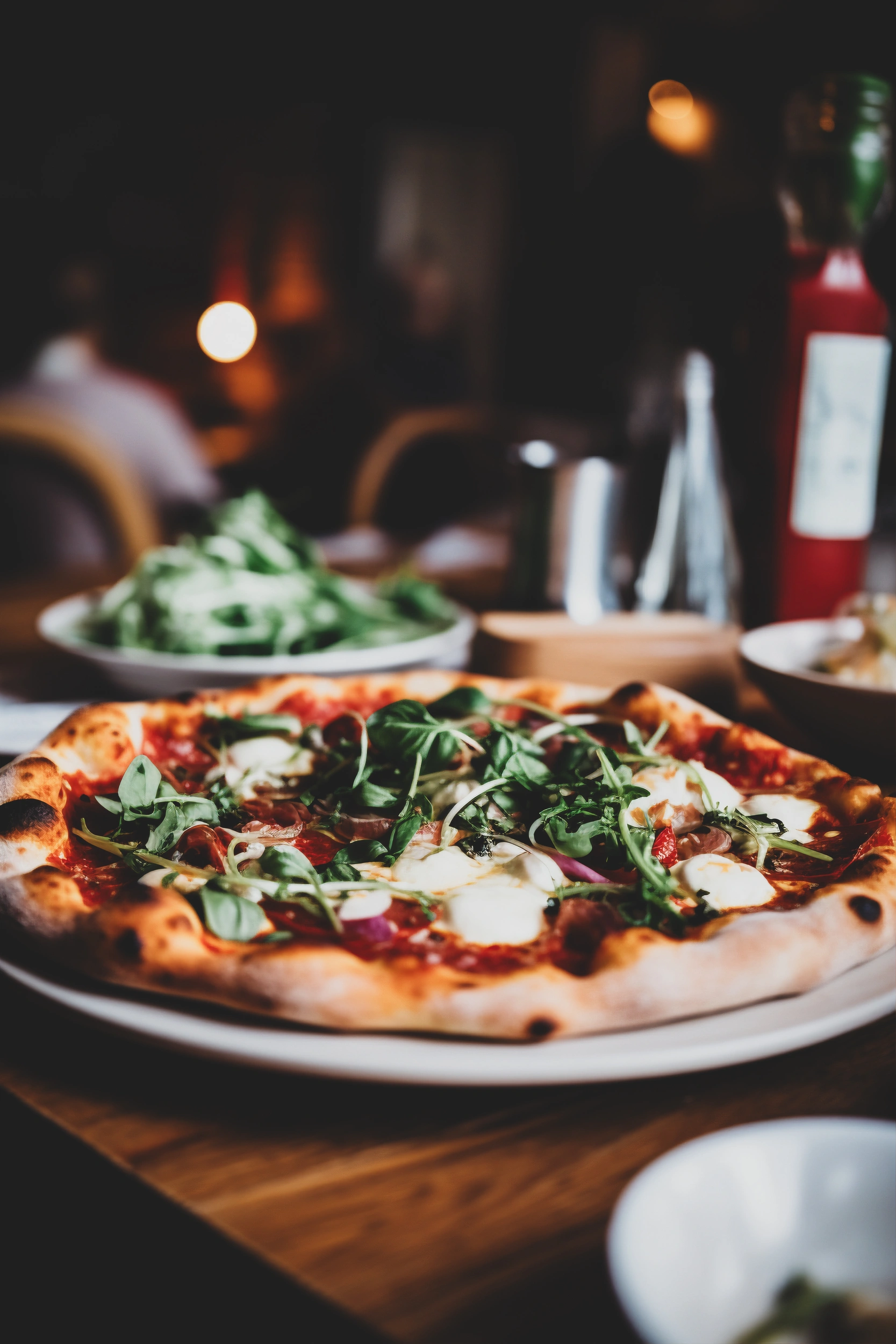 Wood-fired pizza in a restaurant dining scene